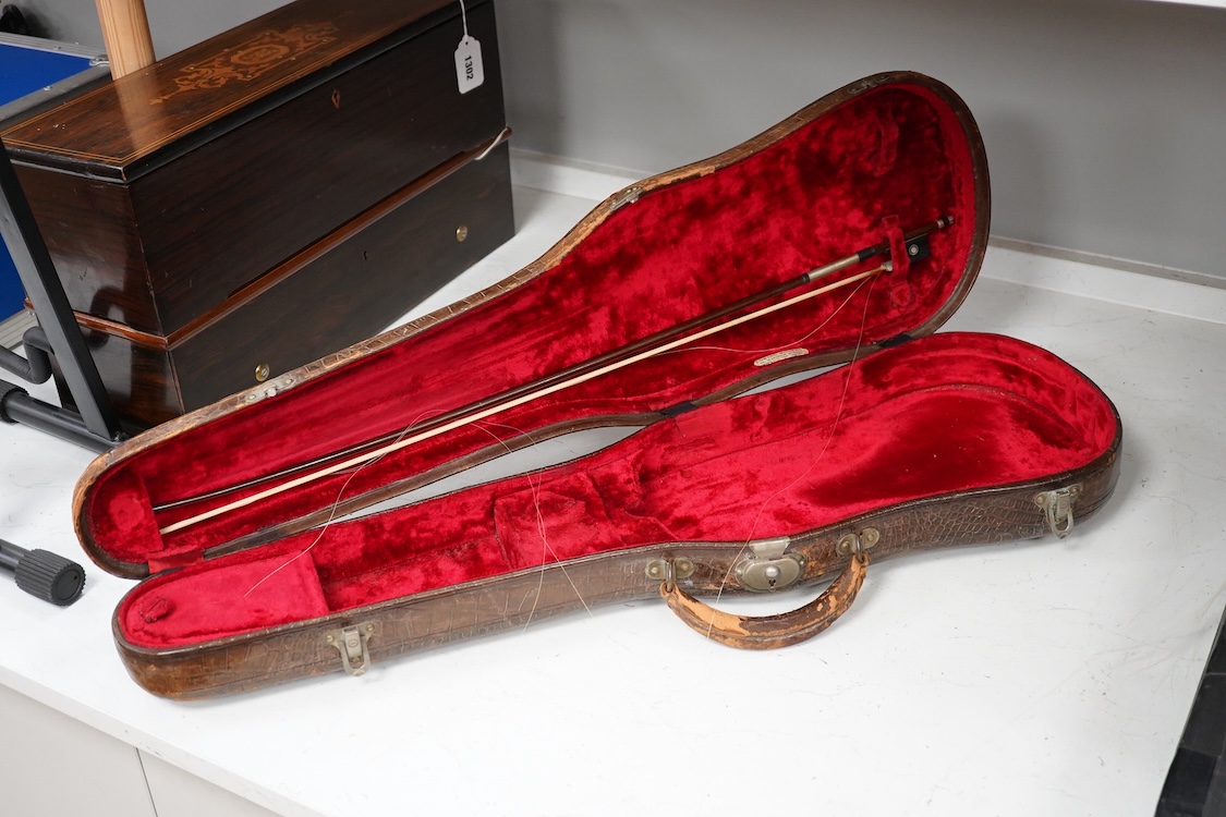 A late 19th century German violin after Pablo Maggini in bird’s eye maple with a fully mounted German bow in a crocodile skin case with retailers ivorine label reading; ‘Edward Withers, 22 Wardour Street, phone City 1899